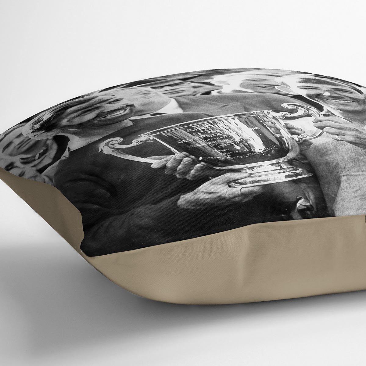 A vibrant abstract cushion featuring Stirling Moss and Tony Brooks design, made from luxurious vegan faux suede with plump filling.