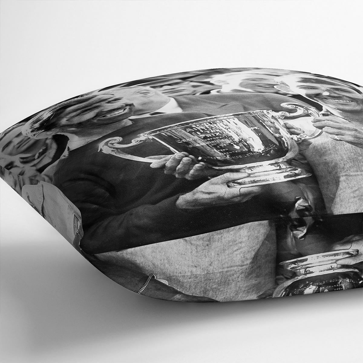 A vibrant abstract cushion featuring Stirling Moss and Tony Brooks design, made from luxurious vegan faux suede with plump filling.