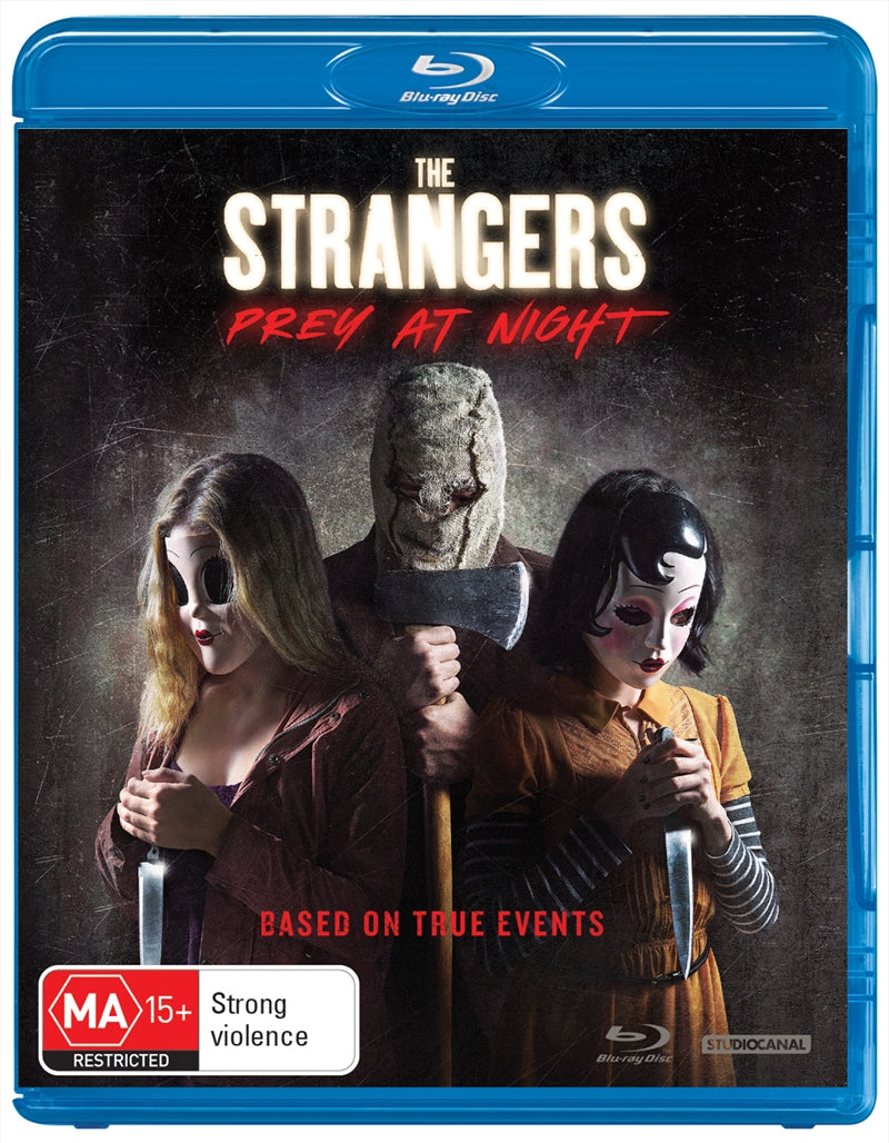 Blu-ray cover of Strangers - Prey At Night featuring a family in a mobile home park surrounded by masked figures.