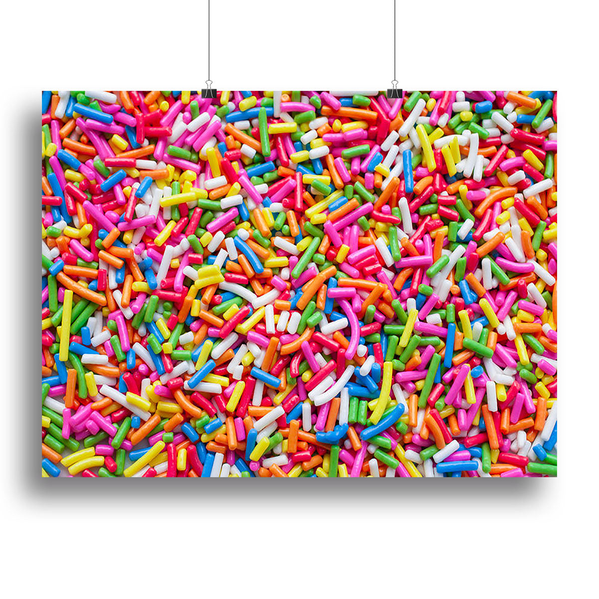 A colorful canvas print featuring vibrant sugar sprinkle dots, perfect for home or office decor.