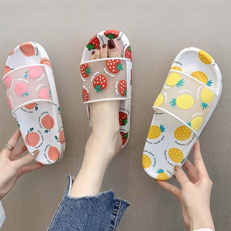 Colorful summer slippers for women featuring cartoon fruit designs of strawberries, pineapples, and peaches.