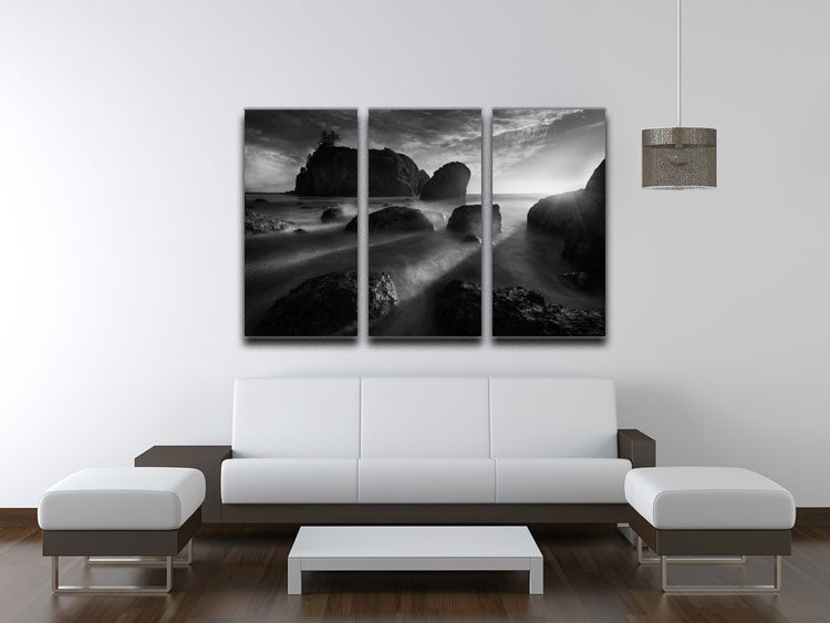 A beautiful 3-panel canvas print featuring sunbeams at the coast, showcasing vibrant colors and serene ocean scenery.