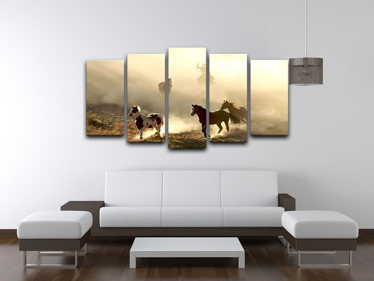 A stunning 5-panel canvas artwork featuring horses in sunlight with a cowboy, creating a dynamic and captivating visual display.