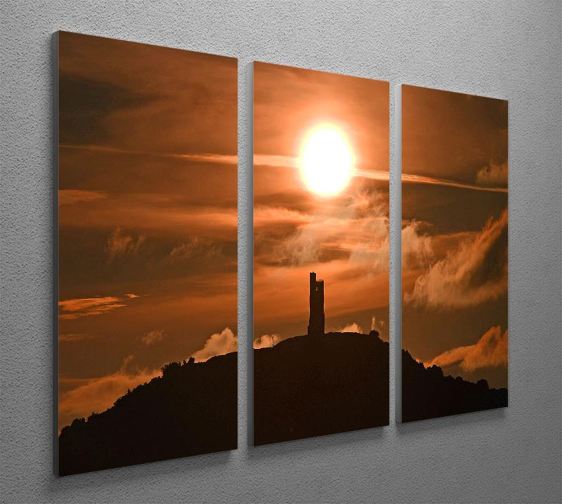 A stunning 3-panel canvas print depicting a sunrise behind Castle Hill, showcasing vibrant colors and intricate details.
