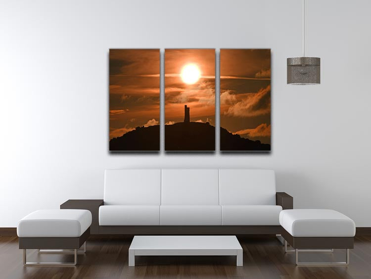 A stunning 3-panel canvas print depicting a sunrise behind Castle Hill, showcasing vibrant colors and intricate details.