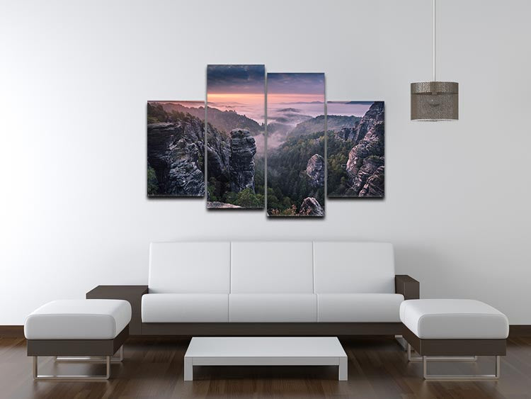 A vibrant 4-split canvas artwork depicting a serene sunrise over rocky terrain, showcasing warm colors and dynamic design.