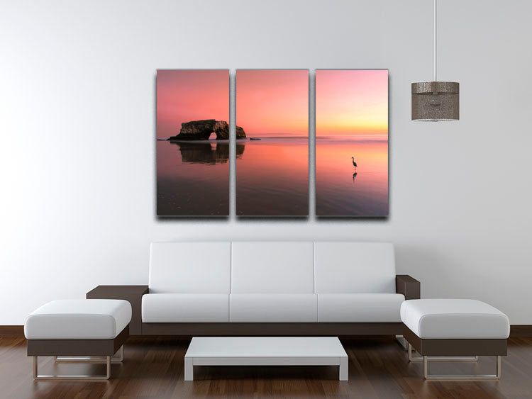 Three-panel canvas print featuring a stunning sunset at the Natural Bridge, showcasing vibrant colors and natural beauty.