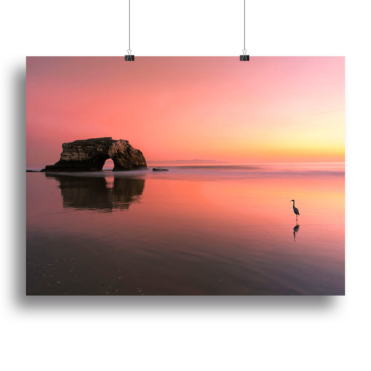 A beautiful canvas print of a sunset over the Natural Bridge, showcasing vibrant colors and serene natural scenery.