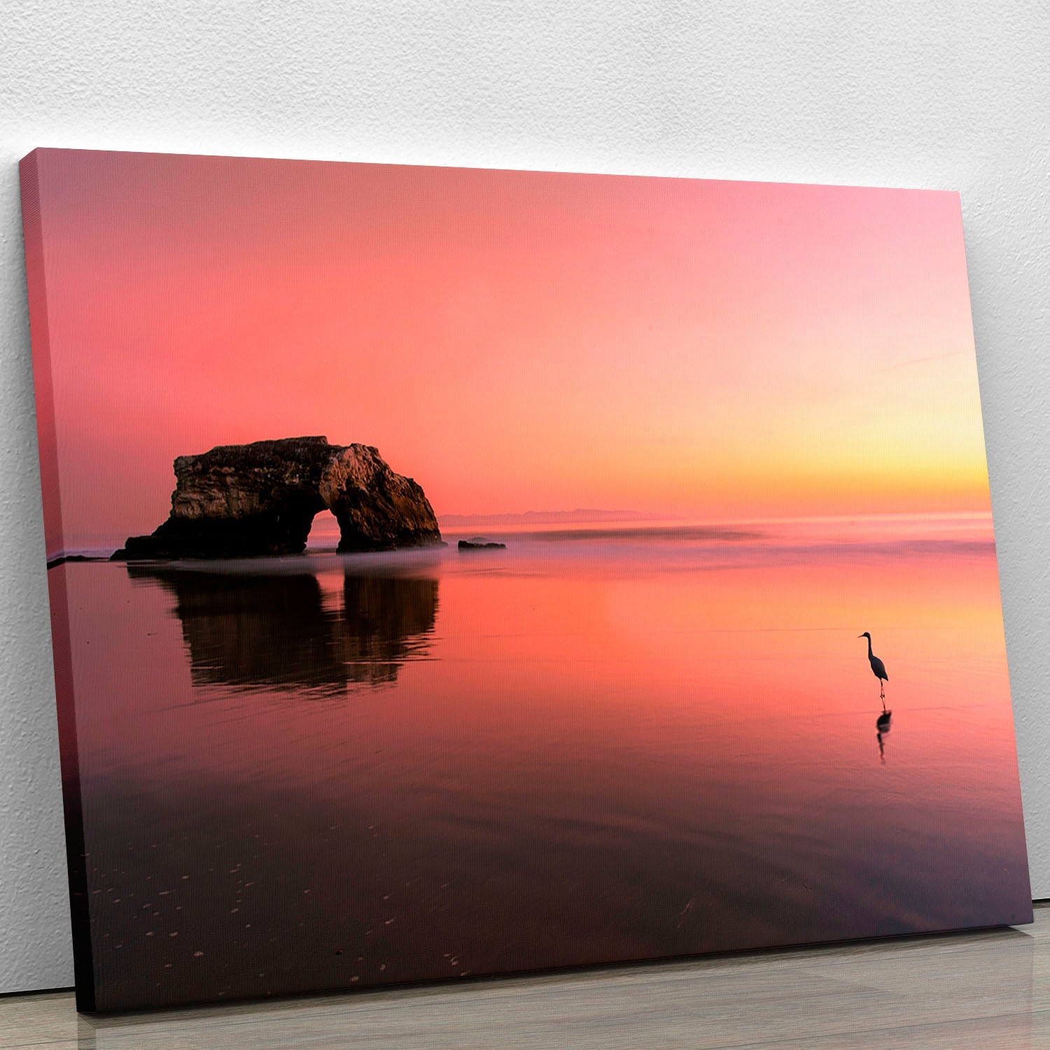 A beautiful canvas print of a sunset over the Natural Bridge, showcasing vibrant colors and serene natural scenery.