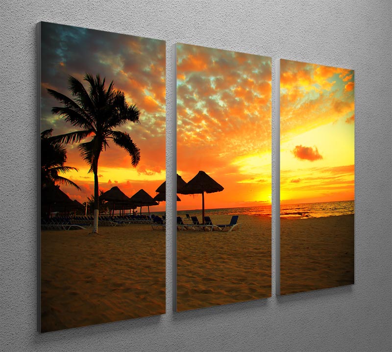 A stunning 3-panel canvas print depicting a tropical beach sunset, showcasing vibrant colors and serene ocean waves.