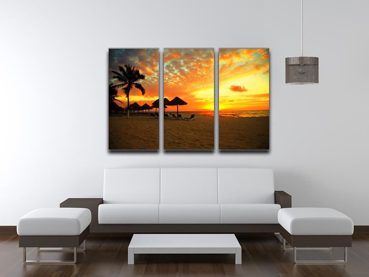A stunning 3-panel canvas print depicting a tropical beach sunset, showcasing vibrant colors and serene ocean waves.