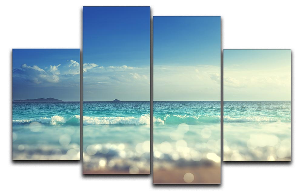 A beautiful sunset scene divided into four equal canvas panels, showcasing vibrant colors and a tilt shift effect.
