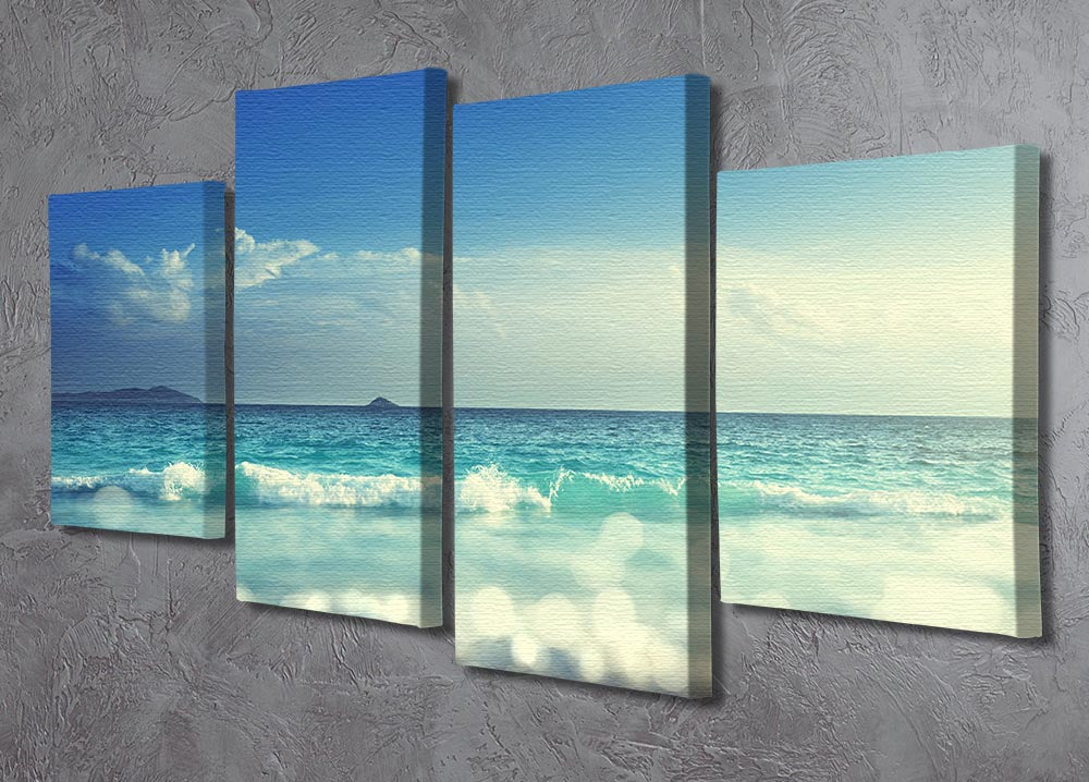 A beautiful sunset scene divided into four equal canvas panels, showcasing vibrant colors and a tilt shift effect.