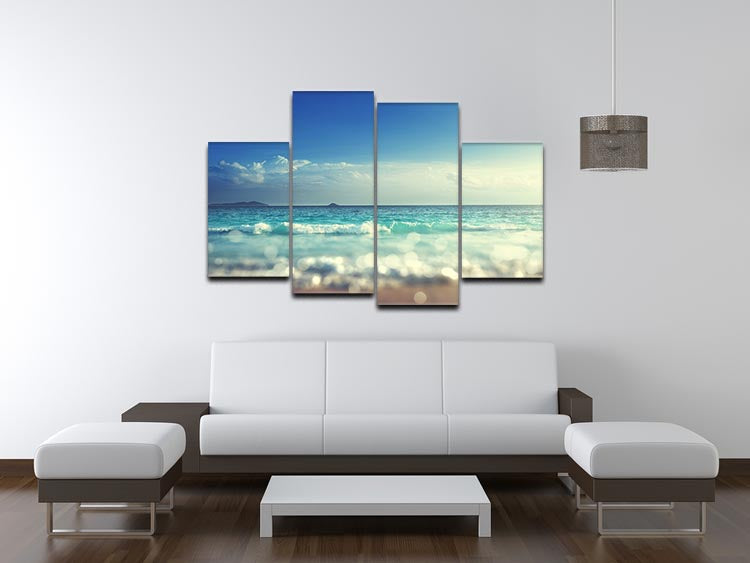 A beautiful sunset scene divided into four equal canvas panels, showcasing vibrant colors and a tilt shift effect.