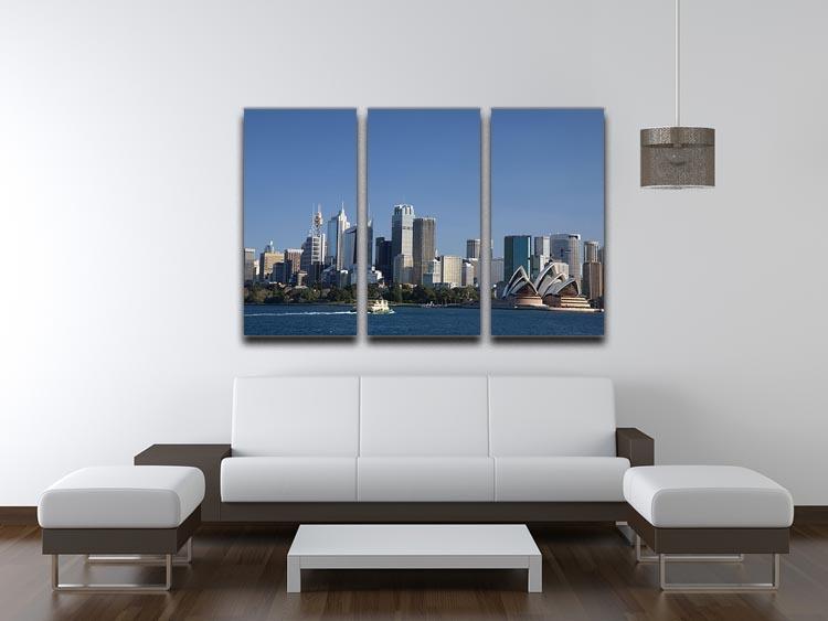 A stunning 3-panel canvas print featuring the Sydney cityscape against a bright blue sky, perfect for home or office decor.