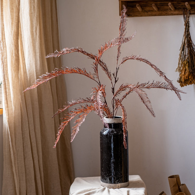 A tall 48-inch artificial fern leaf stem in red-brown color, showcasing realistic foliage details, perfect for home decor.