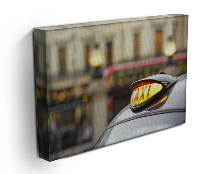 Taxi car selective focus canvas print showcasing urban life with vibrant colors and detailed design.