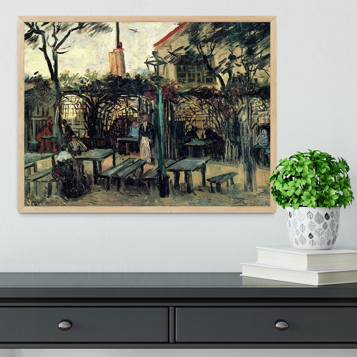 Framed artwork of Terrace of a Cafe on Montmartre La Guinguette1 by Van Gogh, showcasing vibrant colors and intricate details.