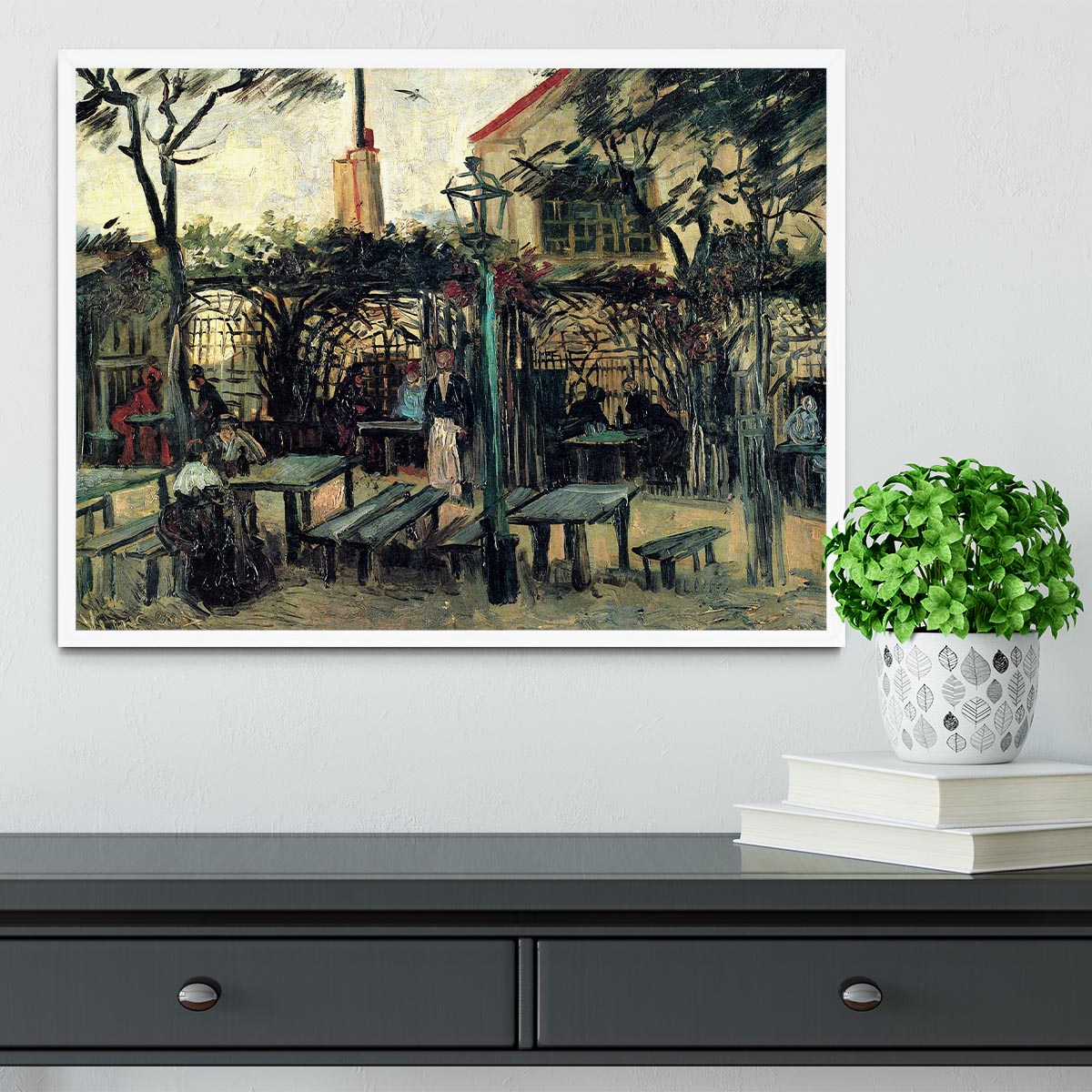 Framed artwork of Terrace of a Cafe on Montmartre La Guinguette1 by Van Gogh, showcasing vibrant colors and intricate details.