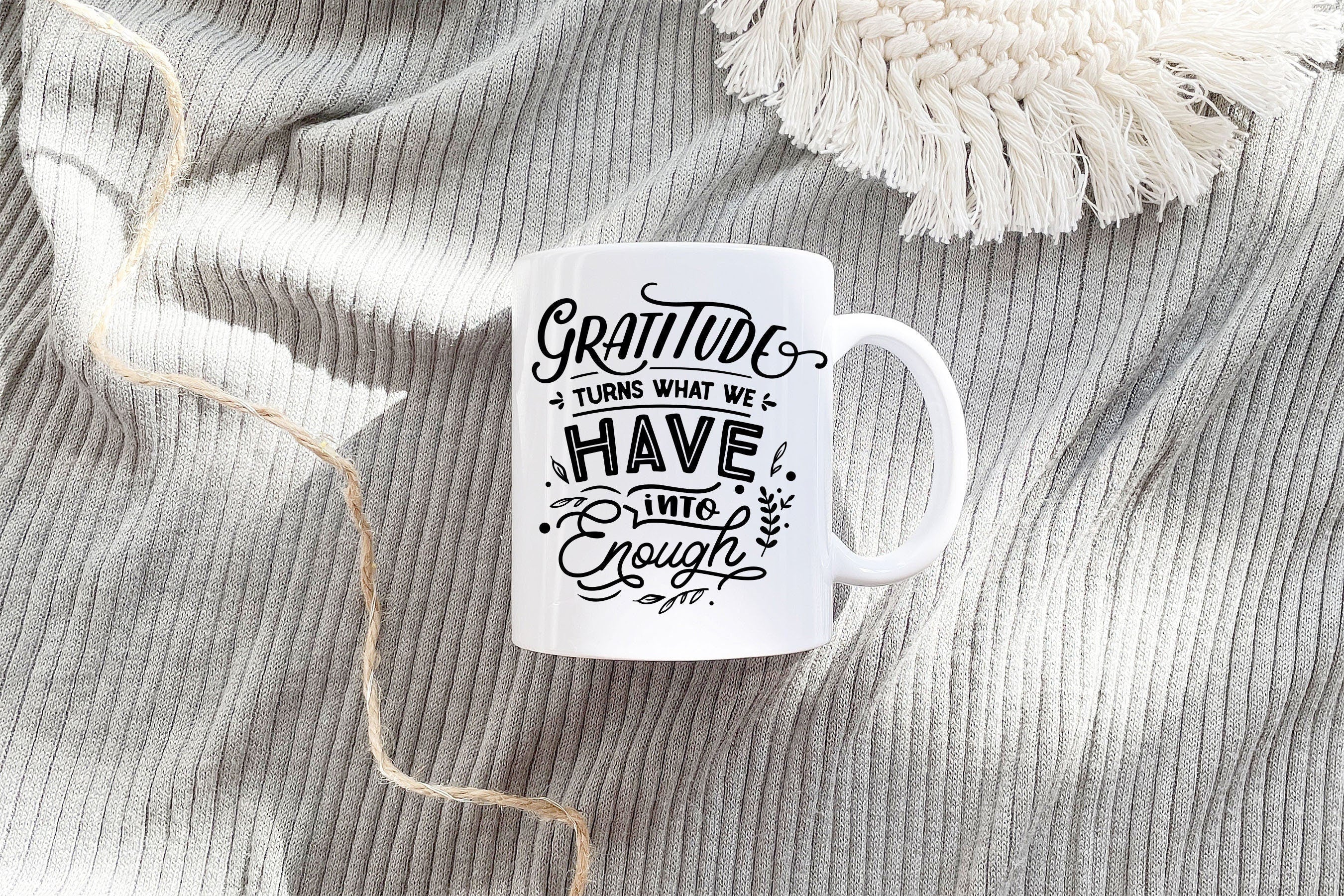 Thanksgiving Mug with the phrase 'Gratitude Turns What We Have Into Enough' printed on both sides, showcasing autumn colors.