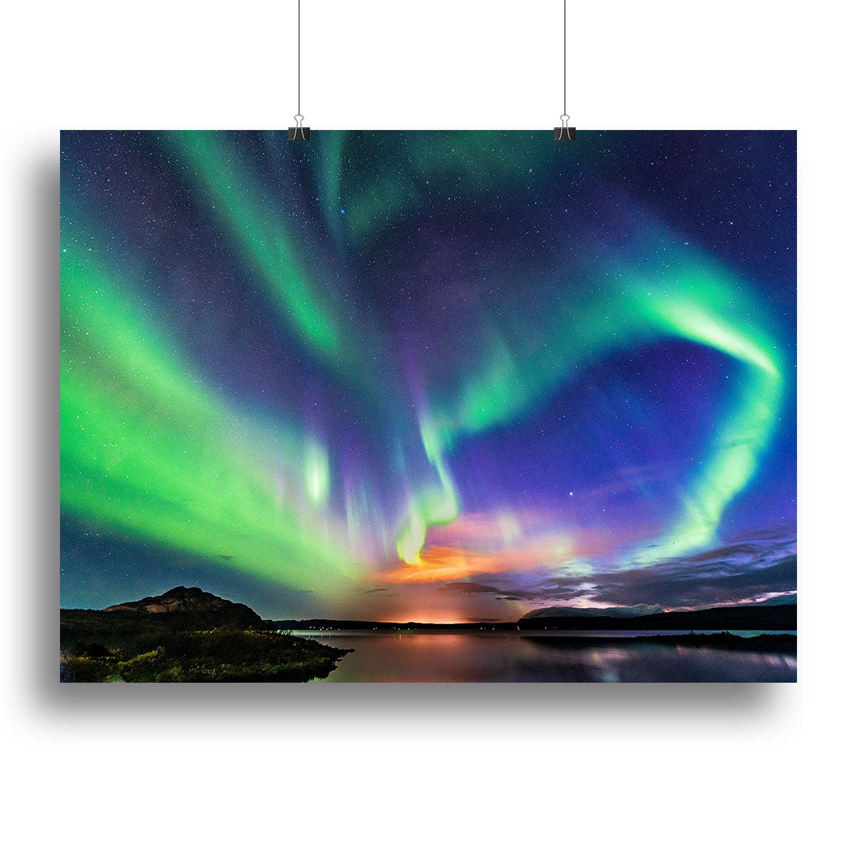 A vibrant canvas print of the aurora borealis over Iceland, showcasing colorful lights in the night sky above a serene landscape.