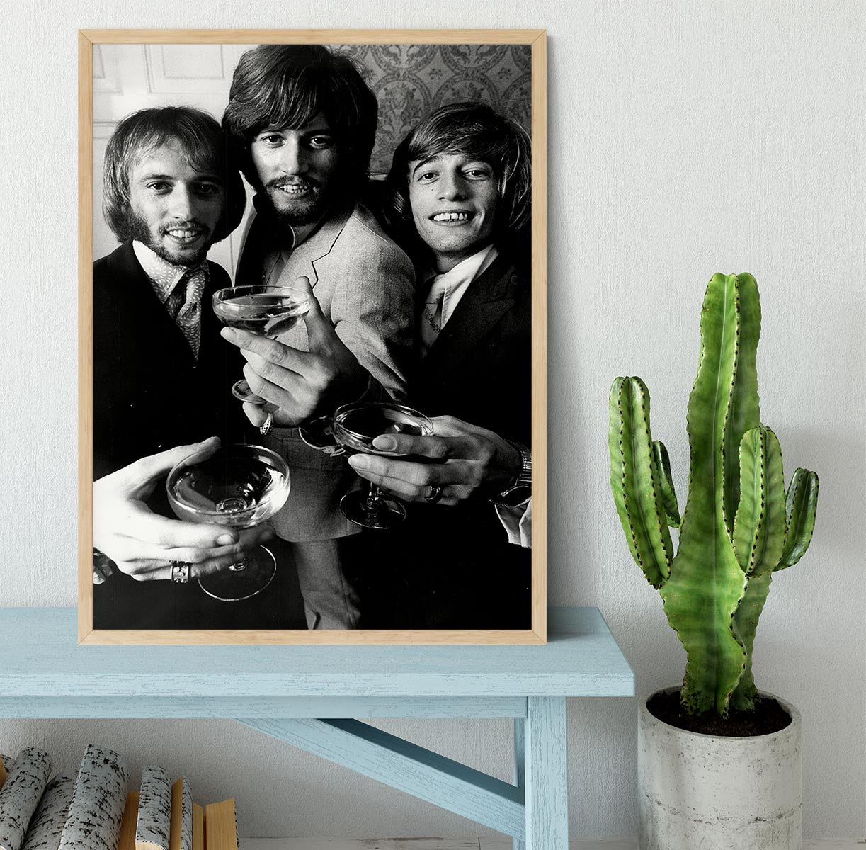 A beautifully framed print of the Bee Gees, showcasing vibrant colors and high-quality craftsmanship in a stylish frame.