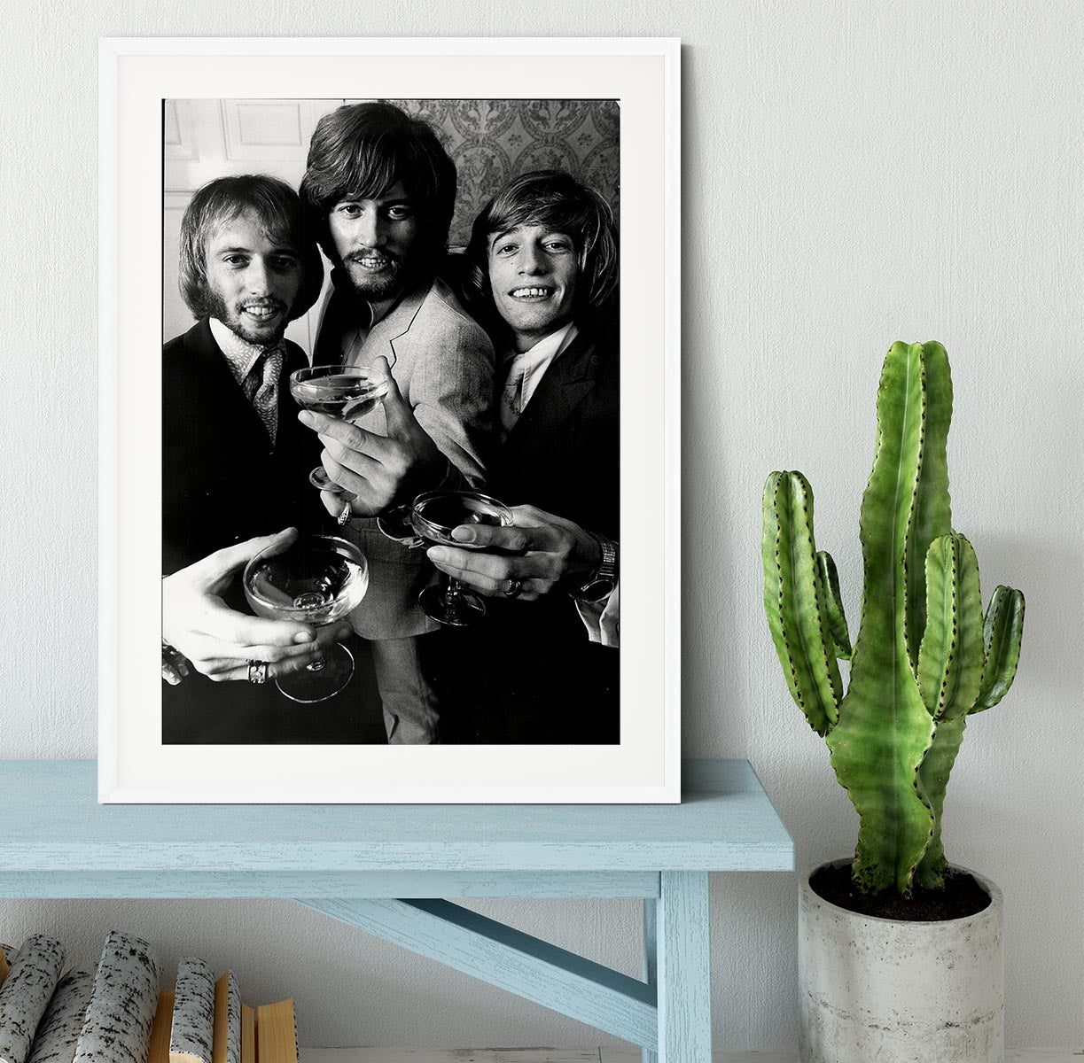A beautifully framed print of the Bee Gees, showcasing vibrant colors and high-quality craftsmanship in a stylish frame.