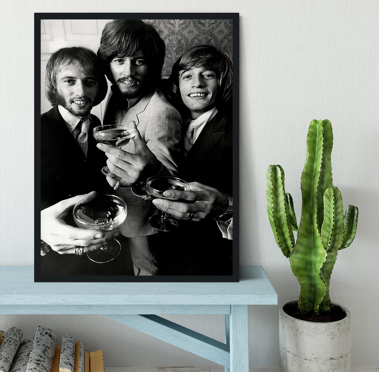 A beautifully framed print of the Bee Gees, showcasing vibrant colors and high-quality craftsmanship in a stylish frame.