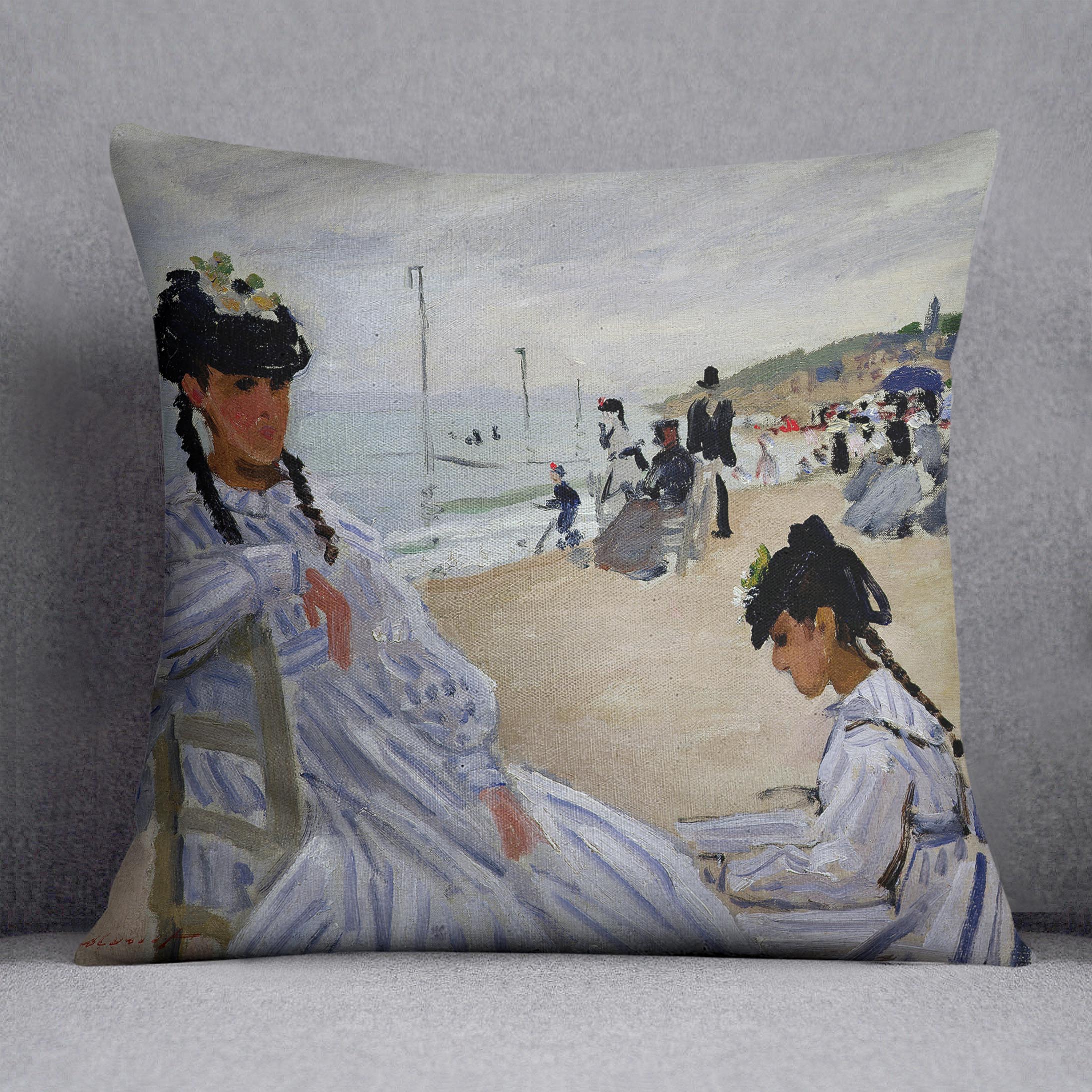 A vibrant cushion featuring Monet's The Beach at Trouville design, made from luxurious vegan faux suede with plump filling.