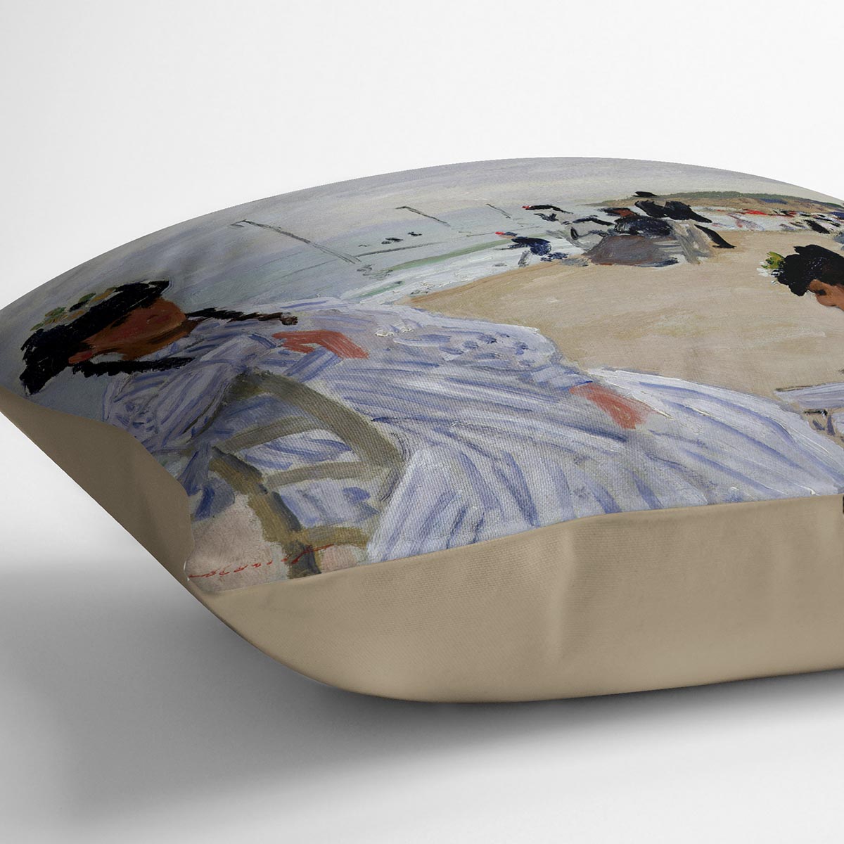 A vibrant cushion featuring Monet's The Beach at Trouville design, made from luxurious vegan faux suede with plump filling.