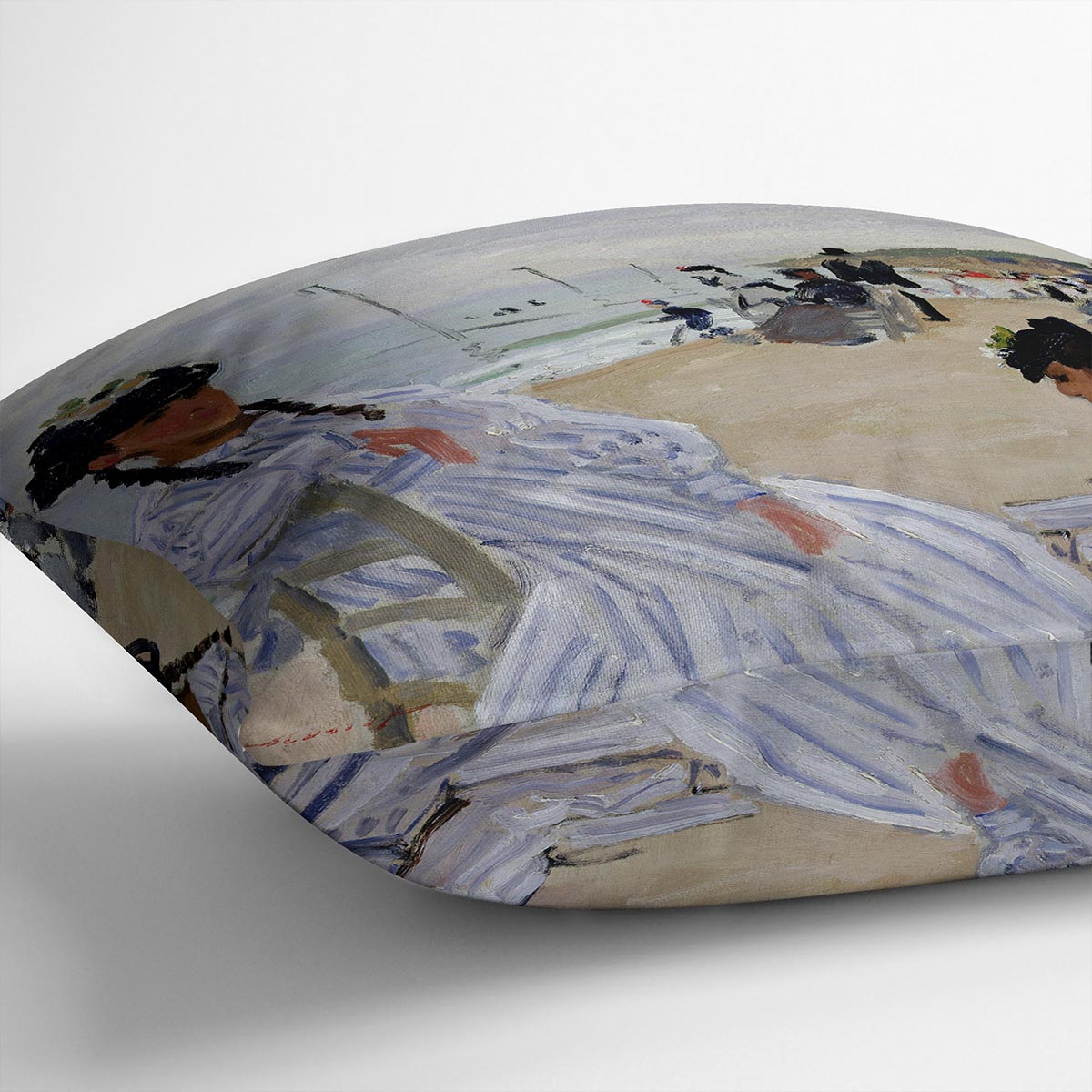 A vibrant cushion featuring Monet's The Beach at Trouville design, made from luxurious vegan faux suede with plump filling.