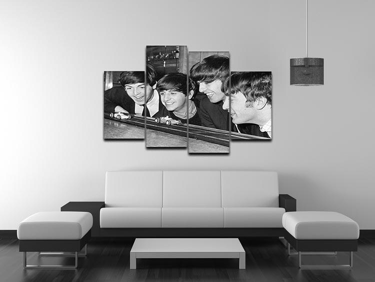 A vibrant 4-split canvas artwork featuring The Beatles playing with toy racing cars, showcasing their playful spirit.