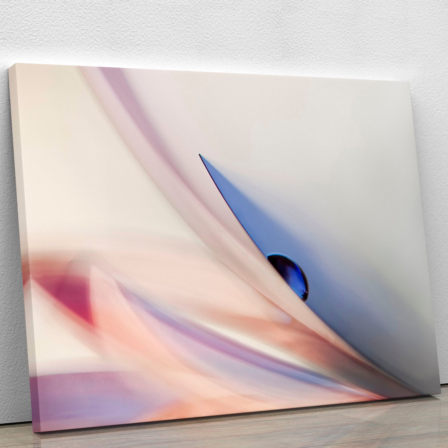 A vibrant blue drop canvas print showcasing elegant abstract art, perfect for modern decor.