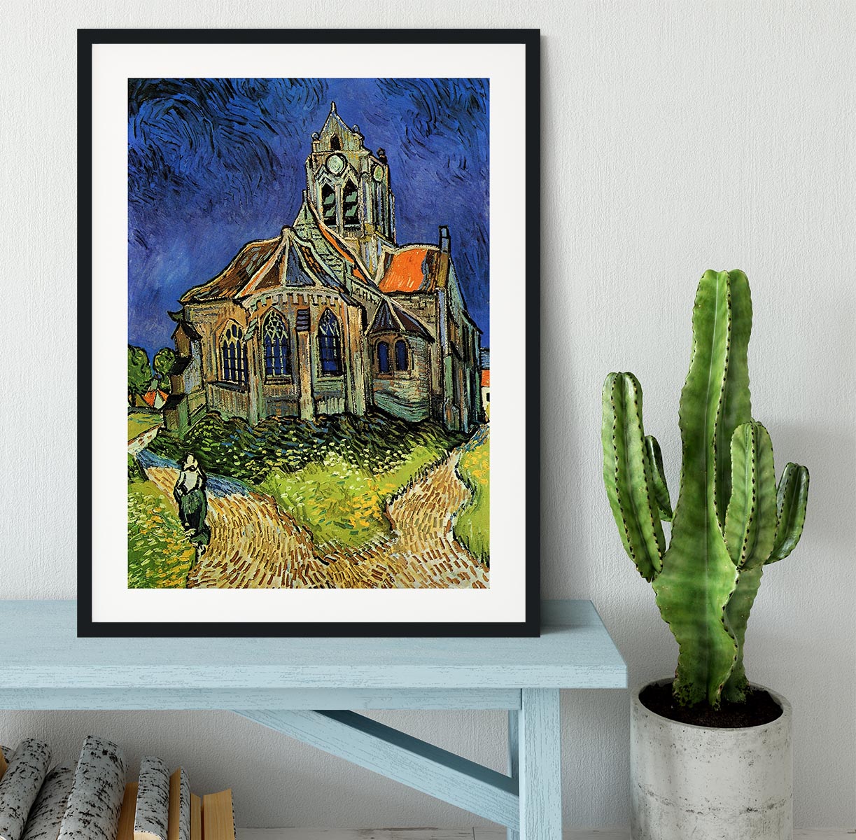 Framed print of The Church at Auvers by Van Gogh, showcasing vibrant colors and intricate details in a stylish black frame.