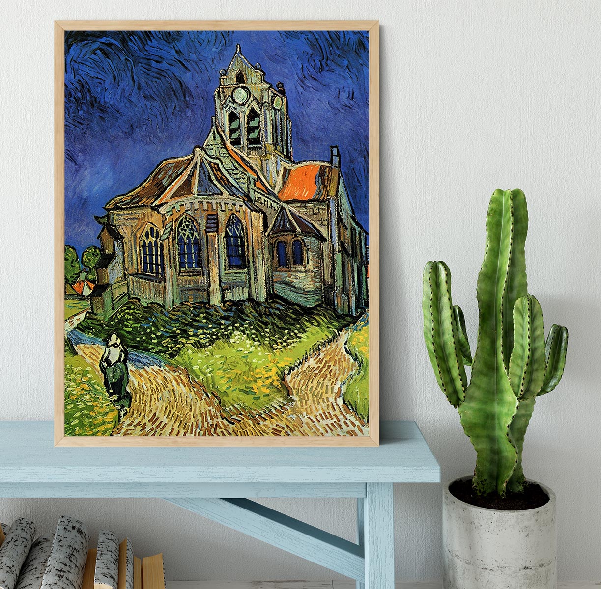 Framed print of The Church at Auvers by Van Gogh, showcasing vibrant colors and intricate details in a stylish black frame.