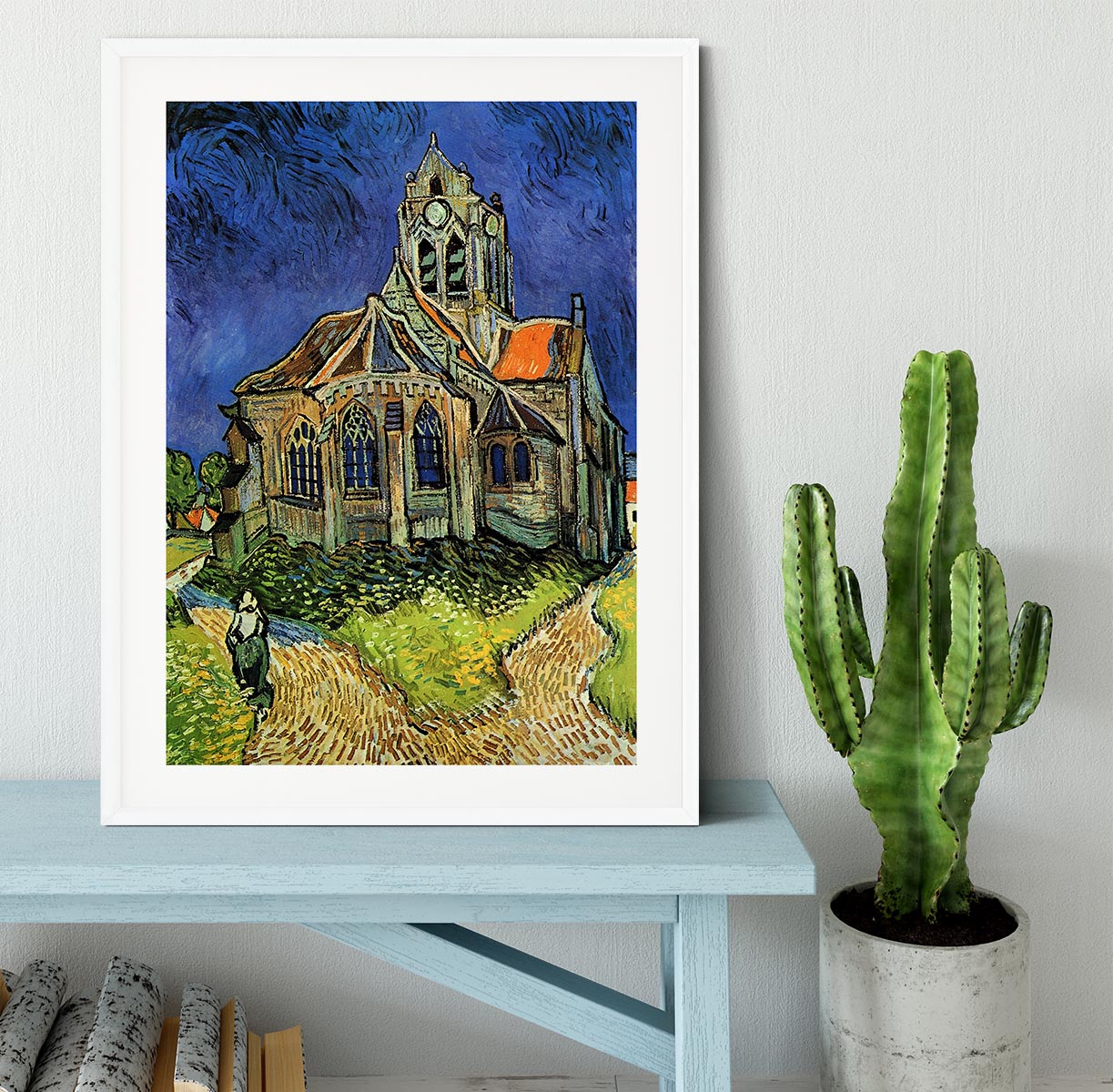 Framed print of The Church at Auvers by Van Gogh, showcasing vibrant colors and intricate details in a stylish black frame.