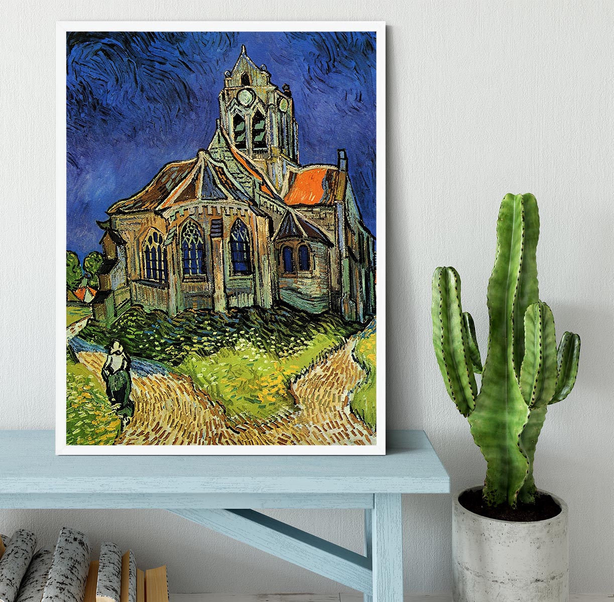 Framed print of The Church at Auvers by Van Gogh, showcasing vibrant colors and intricate details in a stylish black frame.