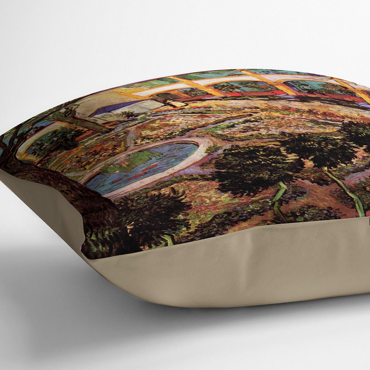 A vibrant cushion featuring Van Gogh's The Courtyard of the Hospital at Arles, made from soft vegan faux suede.