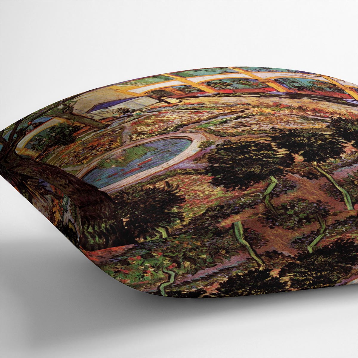 A vibrant cushion featuring Van Gogh's The Courtyard of the Hospital at Arles, made from soft vegan faux suede.