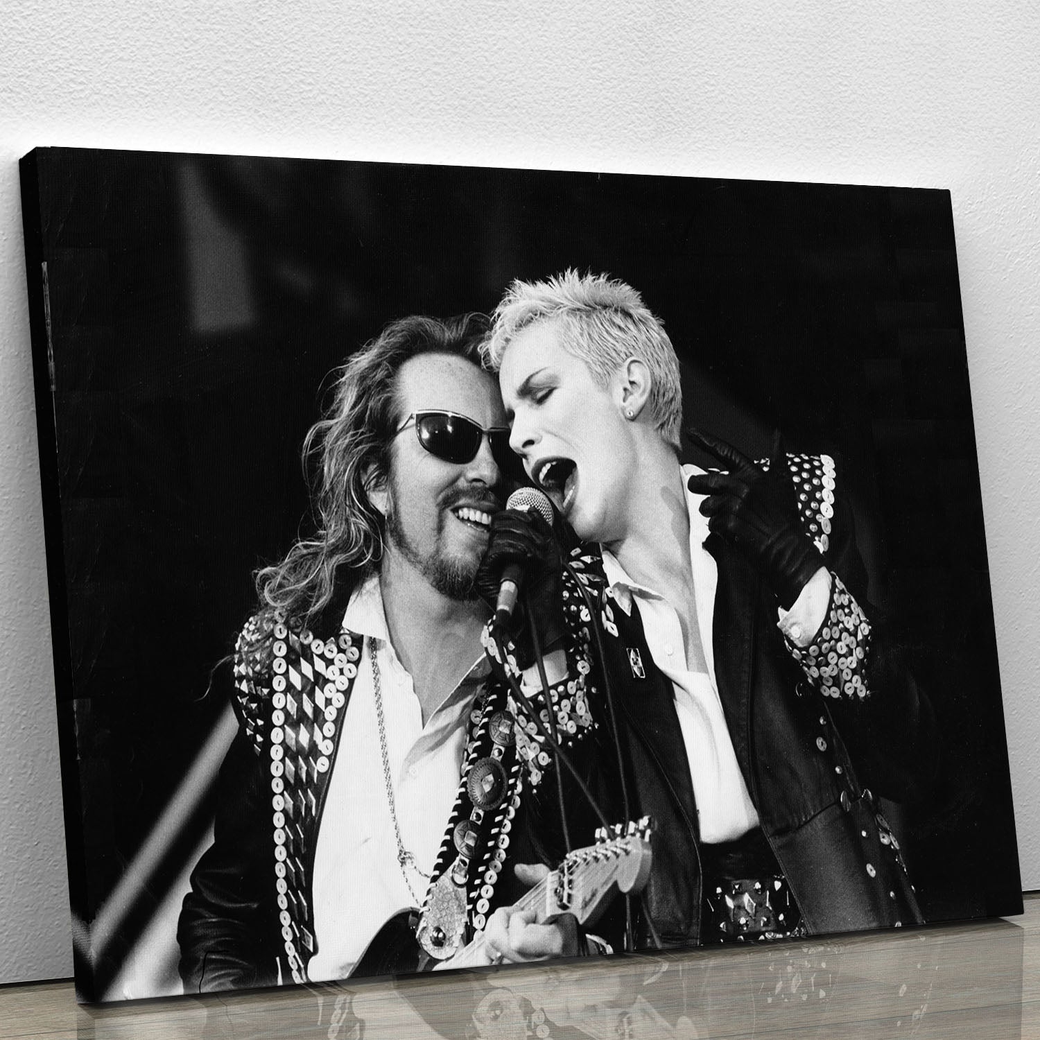The Eurythmics live canvas print showcasing vibrant colors and iconic imagery of the music duo, perfect for home or office decor.