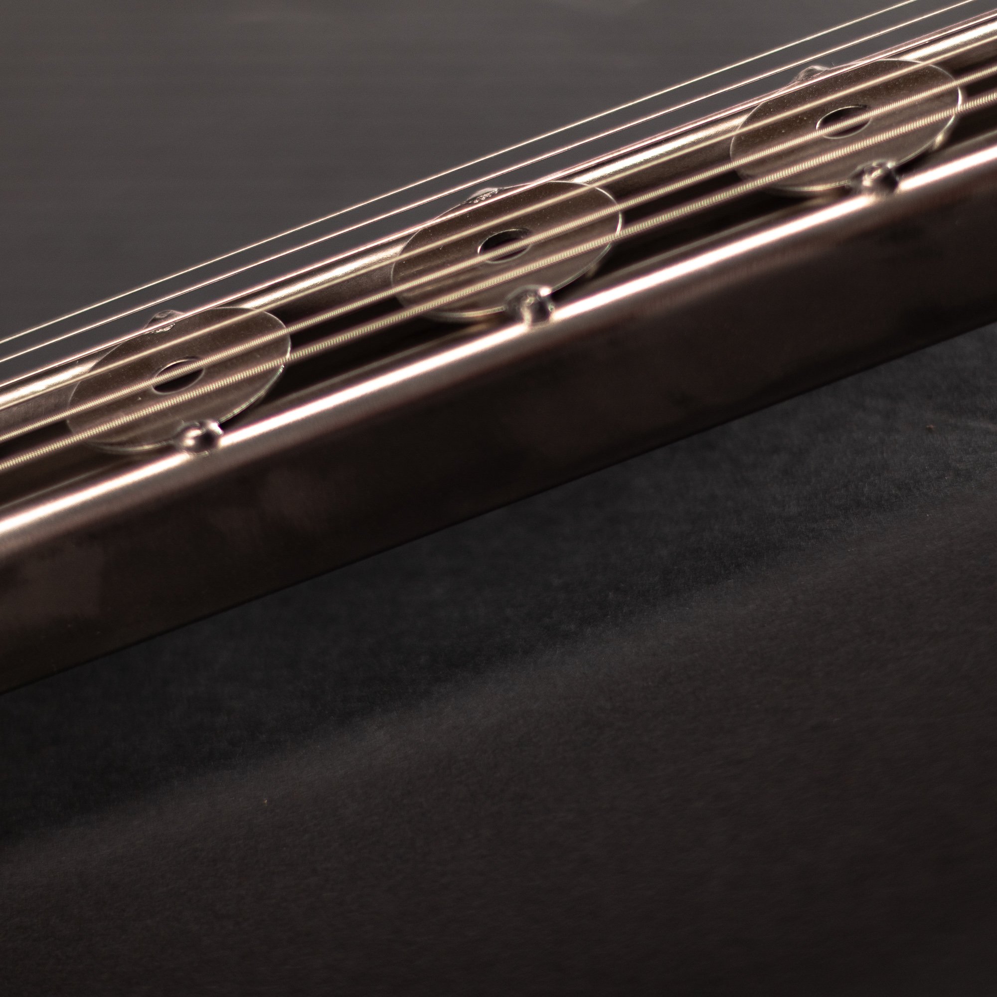 Handmade metal electric guitar sculpture, life-size, crafted from scrap metal with a clear finish.