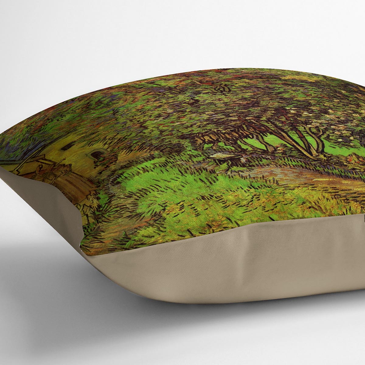 A vibrant cushion featuring Van Gogh's The Garden of Saint-Paul Hospital design, made from luxurious vegan faux suede.