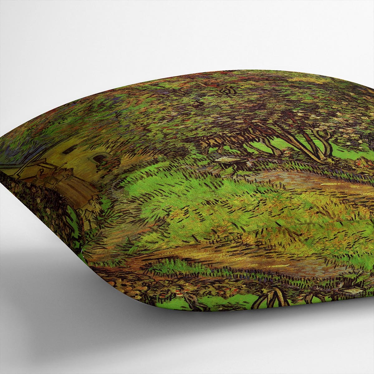 A vibrant cushion featuring Van Gogh's The Garden of Saint-Paul Hospital design, made from luxurious vegan faux suede.