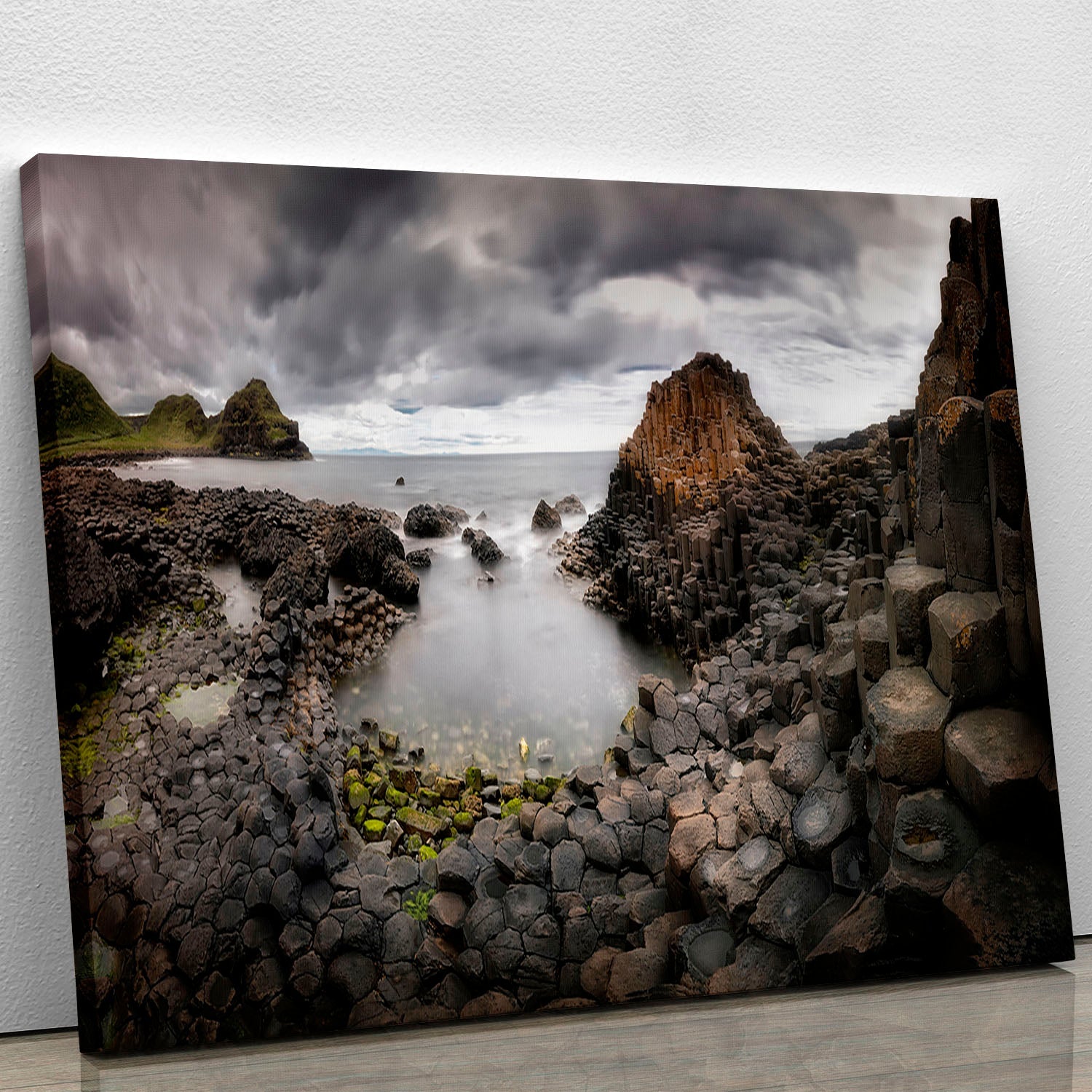 A beautiful canvas print of The Giants Causeway showcasing its unique hexagonal basalt columns and vibrant natural scenery.