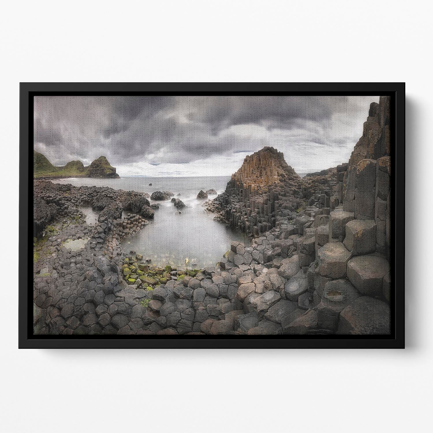The Giants Causeway Floating Framed Canvas featuring vibrant abstract colors and elegant wooden frame.