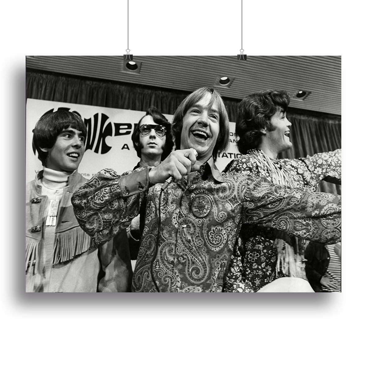 A vibrant canvas print of The Monkees playing around, showcasing their fun and lively spirit.
