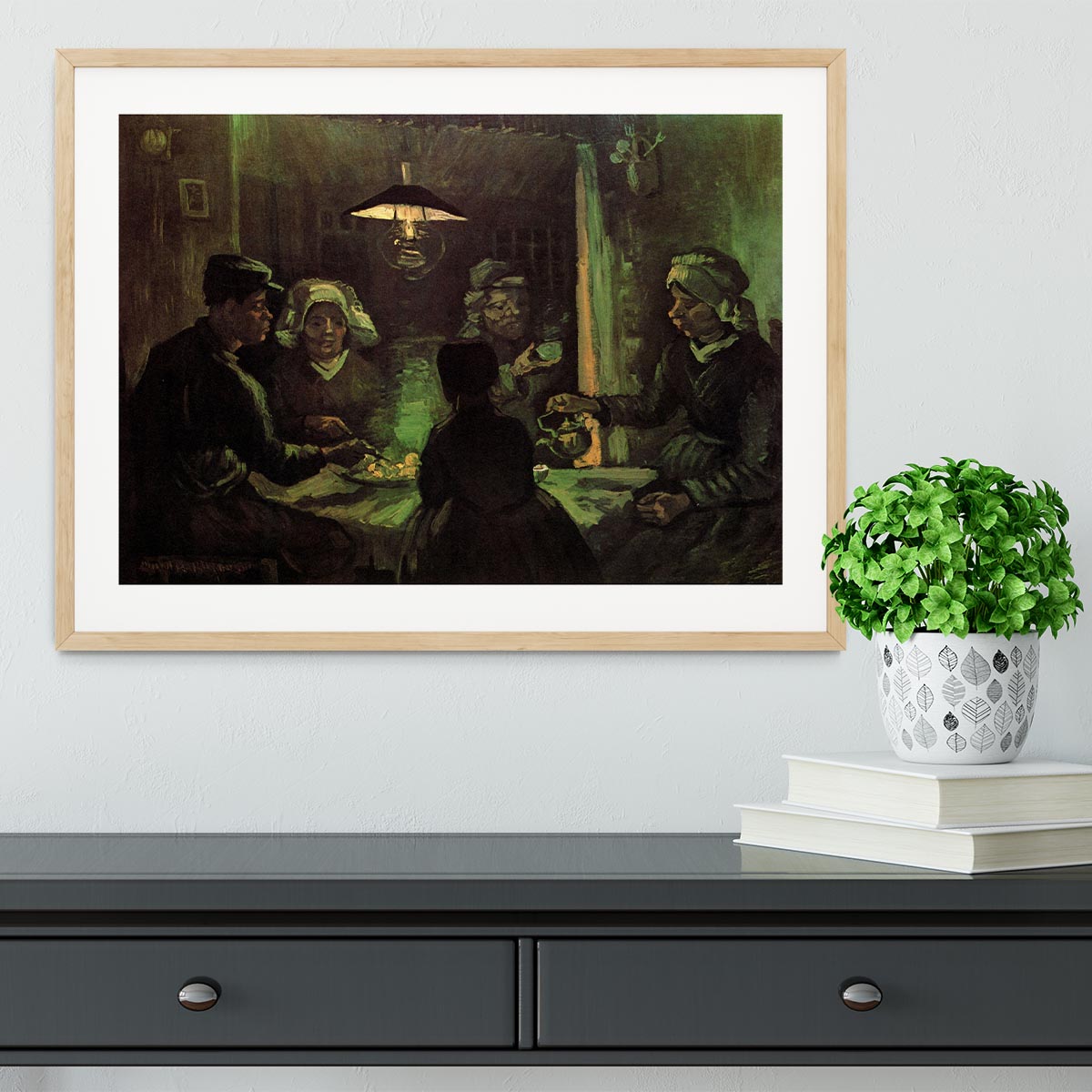 Framed print of Van Gogh's The Potato Eaters, showcasing vibrant colors and quality craftsmanship.
