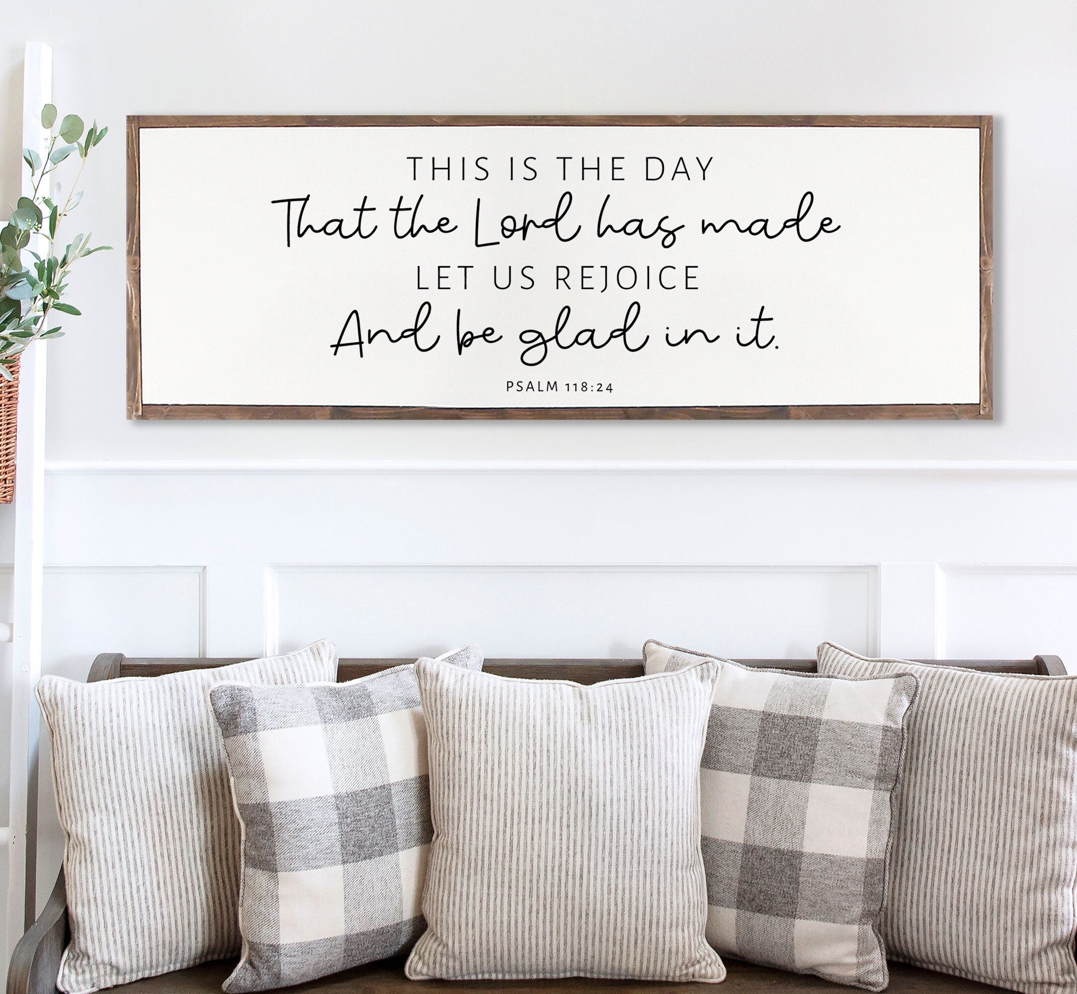 Rustic wood sign featuring the quote 'This Is The Day That The Lord Has Made' from Psalm 118:24, framed in a customizable stain color.