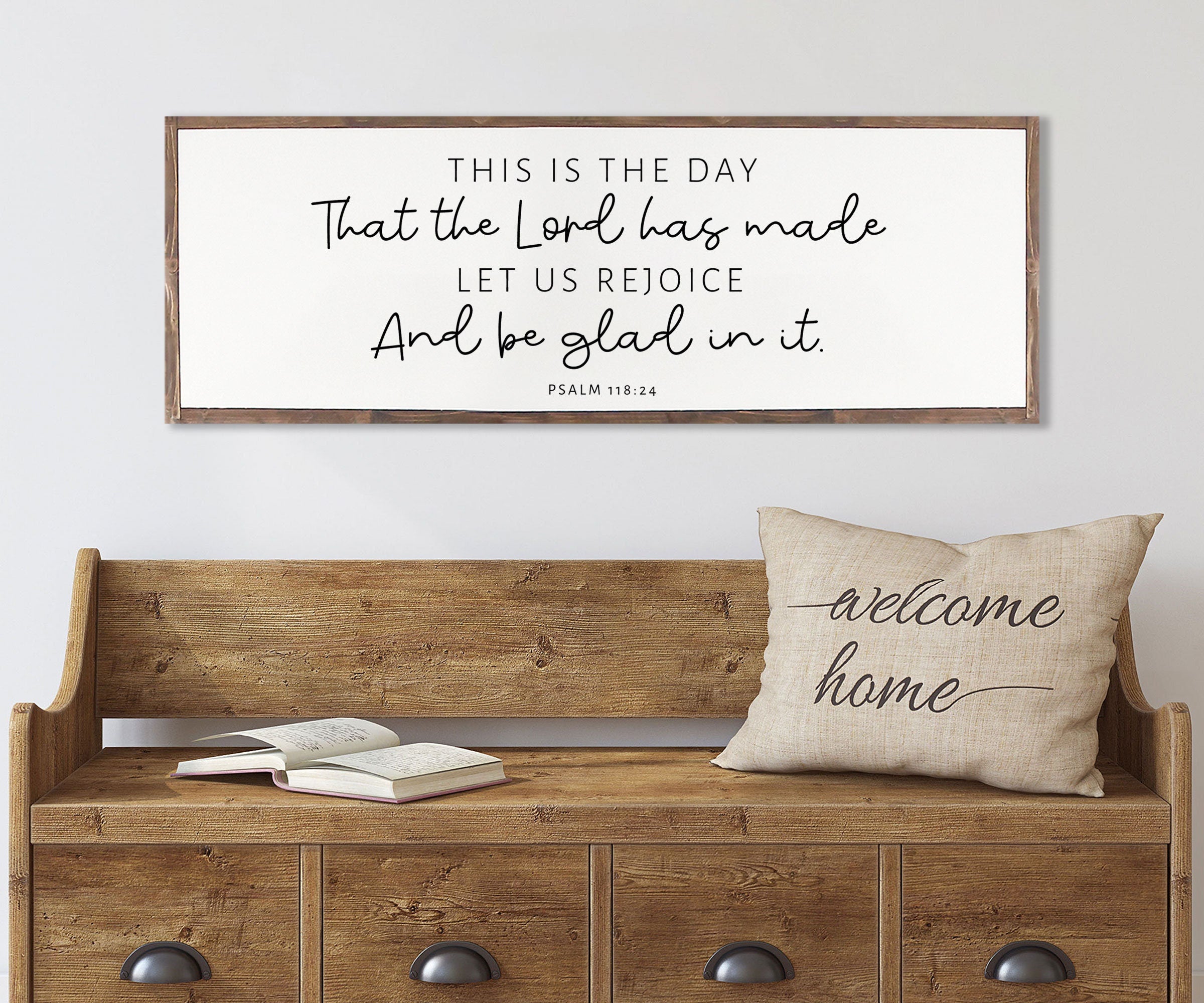 Rustic wood sign featuring the quote 'This Is The Day That The Lord Has Made' from Psalm 118:24, framed in a customizable stain color.