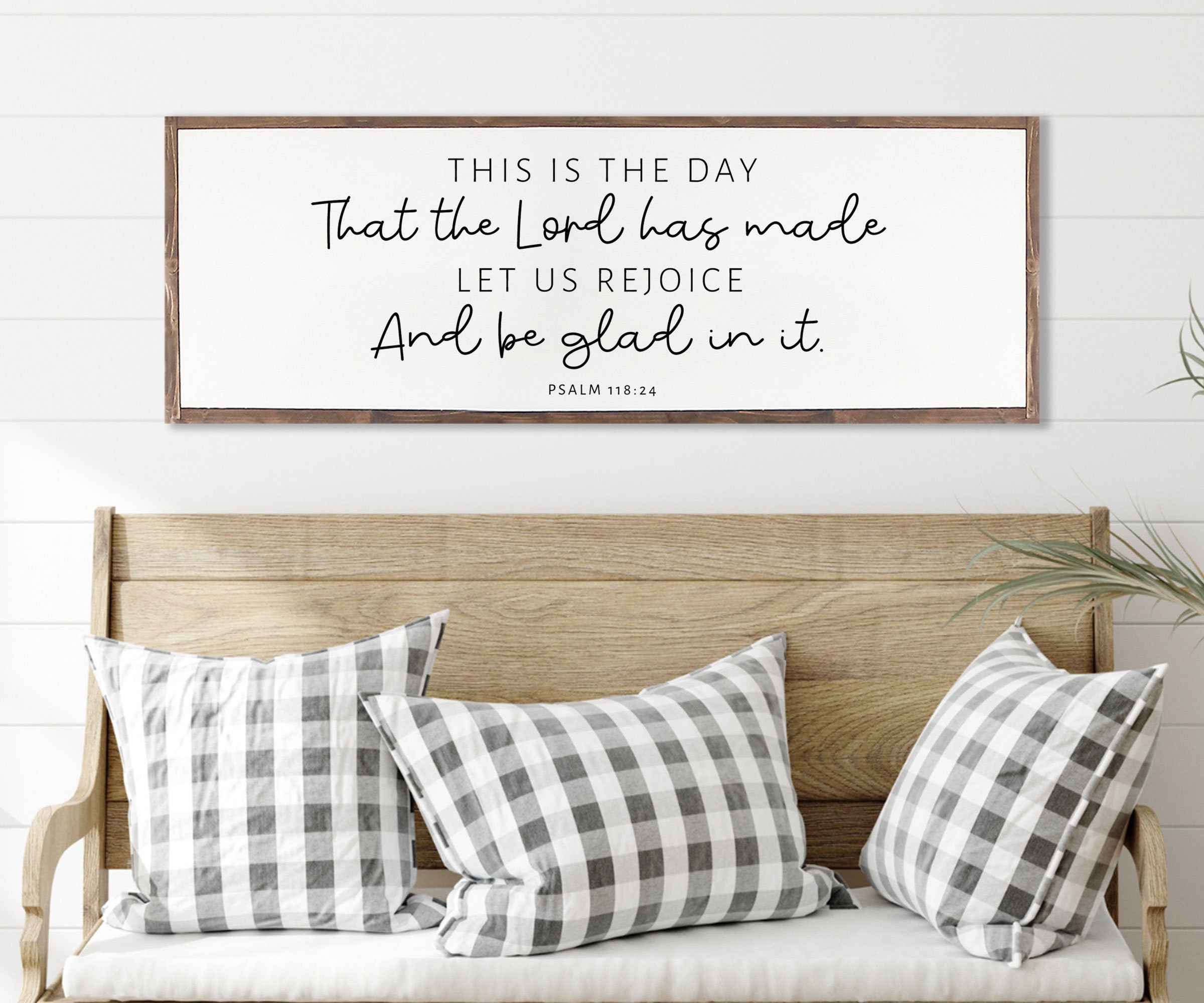 Rustic wood sign featuring the quote 'This Is The Day That The Lord Has Made' from Psalm 118:24, framed in a customizable stain color.
